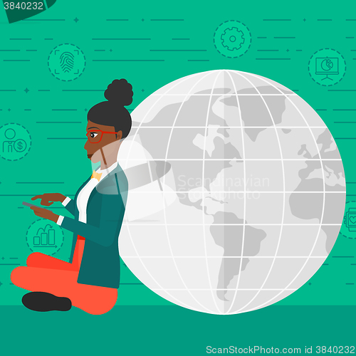 Image of Woman sitting near globe.