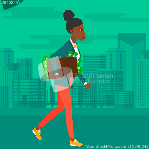 Image of Woman with suitcase full of money.