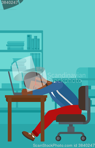 Image of Man sleeping on workplace.