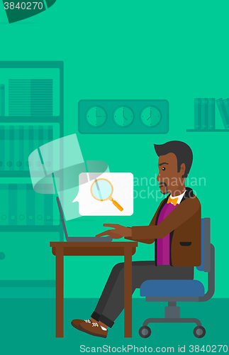 Image of Man working in office.