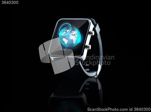 Image of close up of smart watch with earth globe