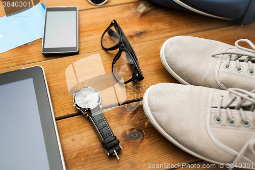 Image of close up of gadgets and traveler personal stuff