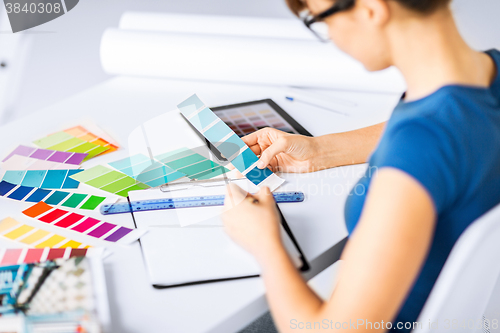 Image of woman working with color samples for selection