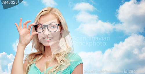 Image of happy young woman or teenage girl in glasses