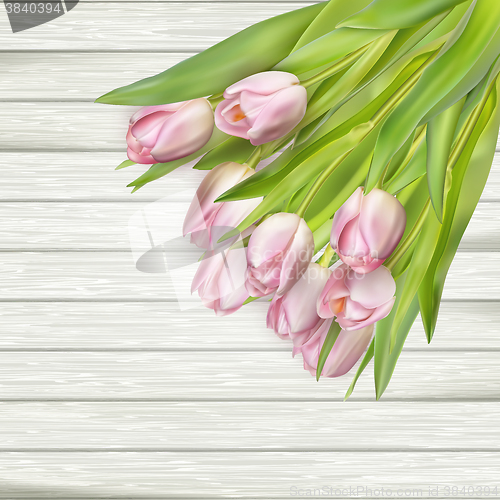 Image of Pink Tulips over wooden table. EPS 10