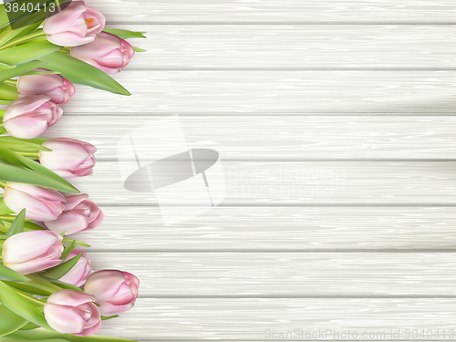 Image of Pink tulips on wooden background. EPS 10