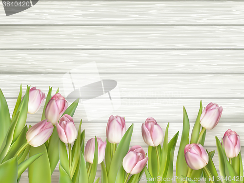 Image of Pink tulips over white wood table. EPS 10