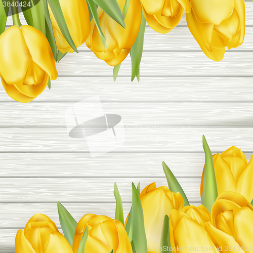 Image of Fresh yellow tulips on wooden background. EPS 10