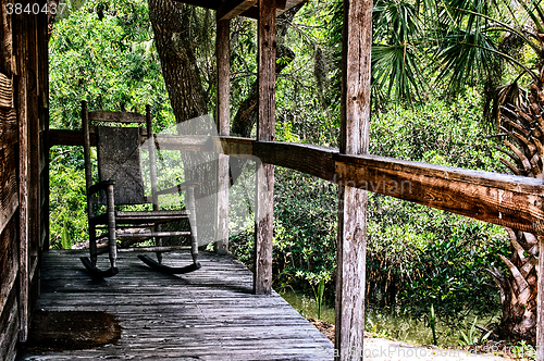 Image of old rocking chair on porch