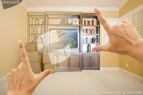 Image of Hands Framing Drawing of Entertainment Unit Gradating Into Photo