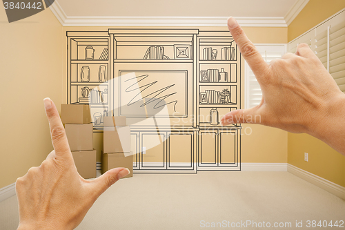 Image of Hands Framing Drawing of Entertainment Unit In Empty Room