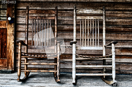 Image of two old wooden rocking chairs