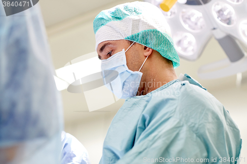 Image of group of surgeons in operating room at hospital