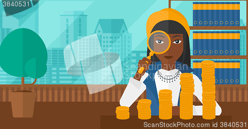 Image of Woman with magnifier and golden coins. 