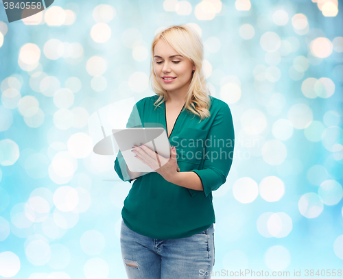 Image of smiling woman with tablet pc computer