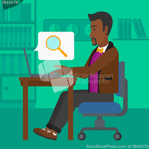 Image of Man working in office.