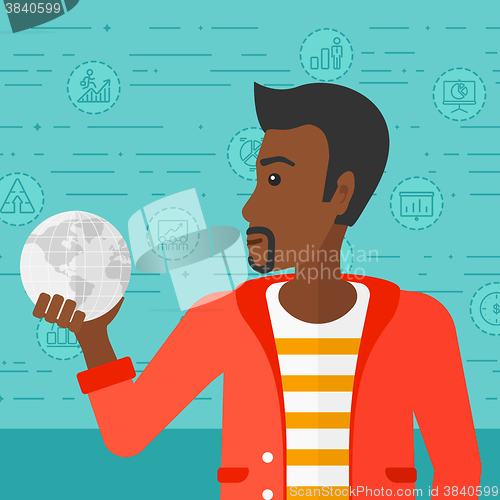 Image of Man holding globe.