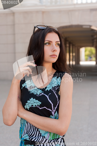 Image of Beautiful girl in bright dress at urban background