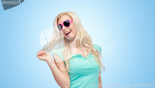 Image of happy young blonde woman or teenager in sunglasses