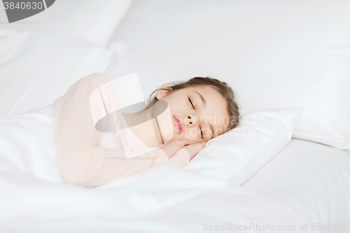 Image of girl sleeping in bed at home