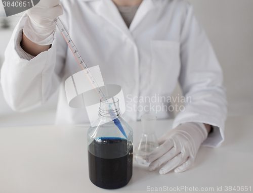 Image of close up of scientist making test in lab