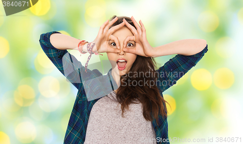 Image of happy teenage girl making face and having fun