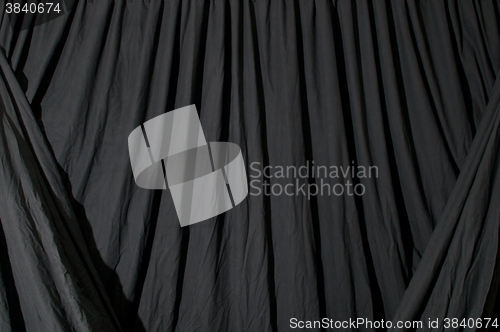 Image of Draped black background fabric