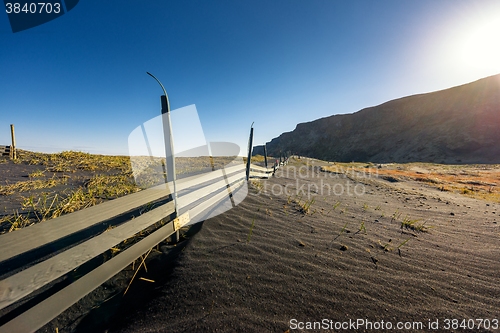 Image of Deserted shore with black sand