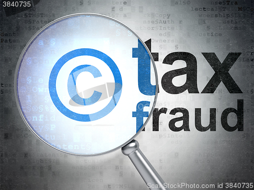 Image of Law concept: Copyright and Tax Fraud with optical glass