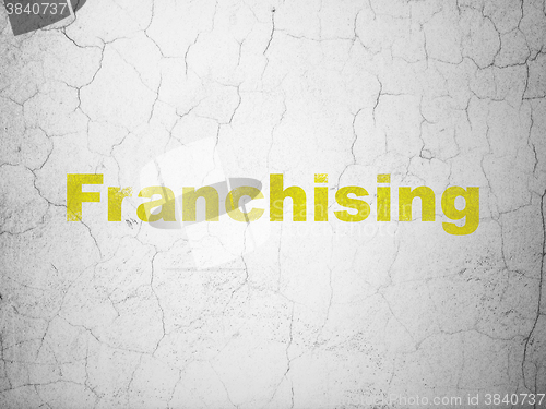 Image of Finance concept: Franchising on wall background