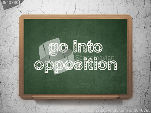 Image of Politics concept: Go into Opposition on chalkboard background
