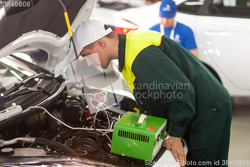 Image of Young car mechanic passes competition stage.Tyumen