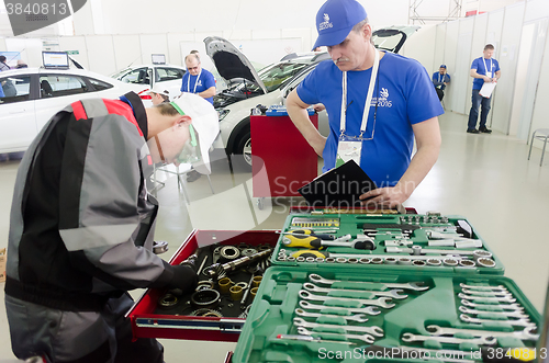 Image of Young car mechanic passes competition stage.Tyumen