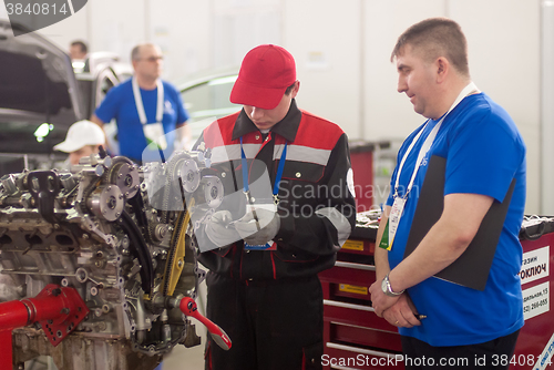 Image of Young car mechanic passes competition stage.Tyumen