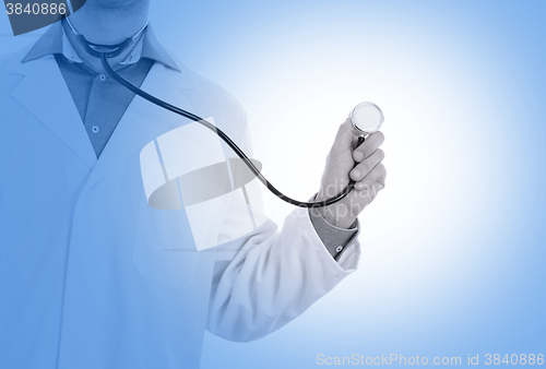 Image of Close up of a Doctor\'s hand, holding a stethoscope, medical blue