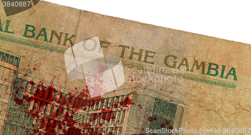 Image of 10 Gambian dalasi bank note, bloody