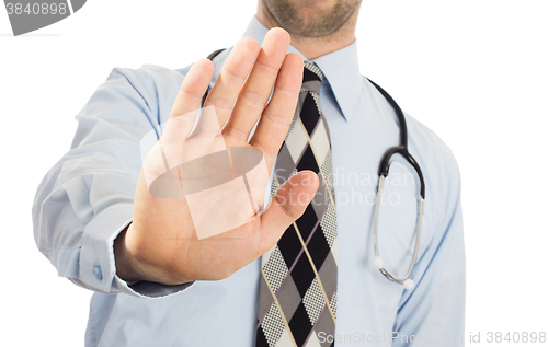 Image of Male doctor holding up his hand in a Halt or Stop gesture