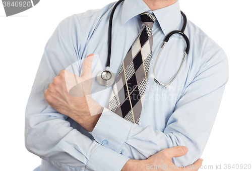 Image of Close up of male doctor hand showing thumbs up