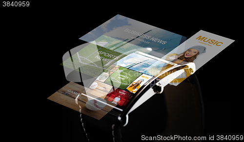 Image of close up of smart watch with media projection