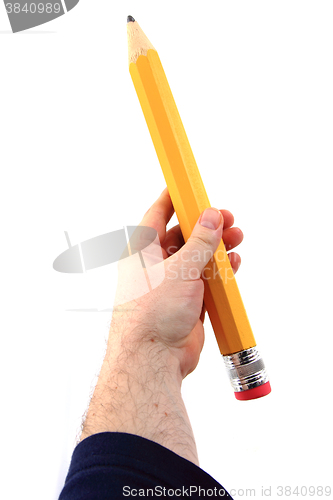 Image of big pencil in human hand