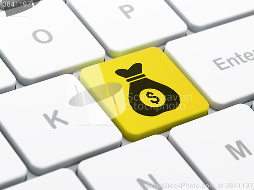 Image of Finance concept: Money Bag on computer keyboard background