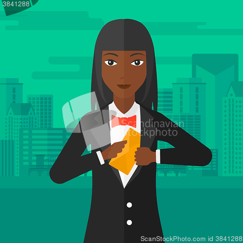 Image of Woman putting envelope in pocket.