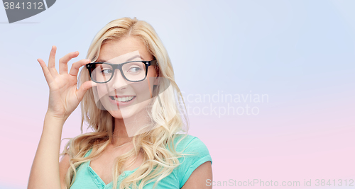 Image of happy young woman or teenage girl in glasses