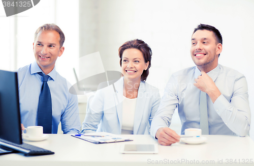 Image of business team discussing something in office