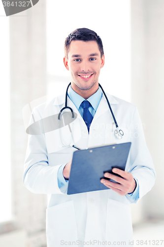 Image of male doctor writing prescription