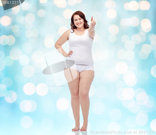 Image of plus size woman in underwear showing thumbs up