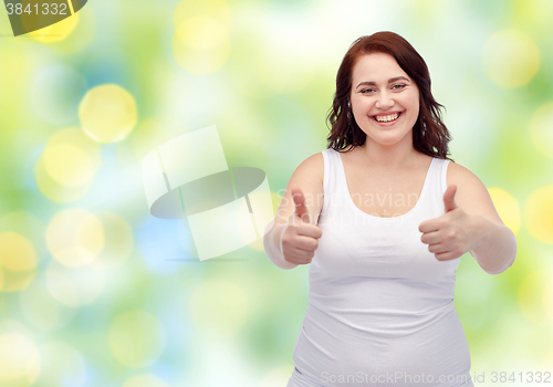 Image of plus size woman in underwear showing thumbs up