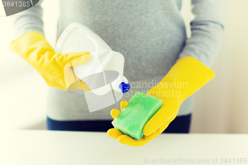 Image of close up of woman with sponge and cleanser