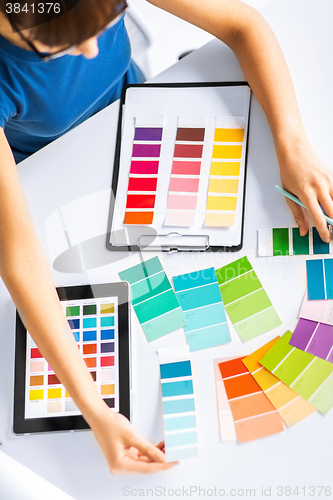 Image of woman working with color samples for selection