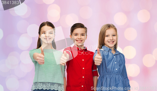 Image of happy children showing thumbs up